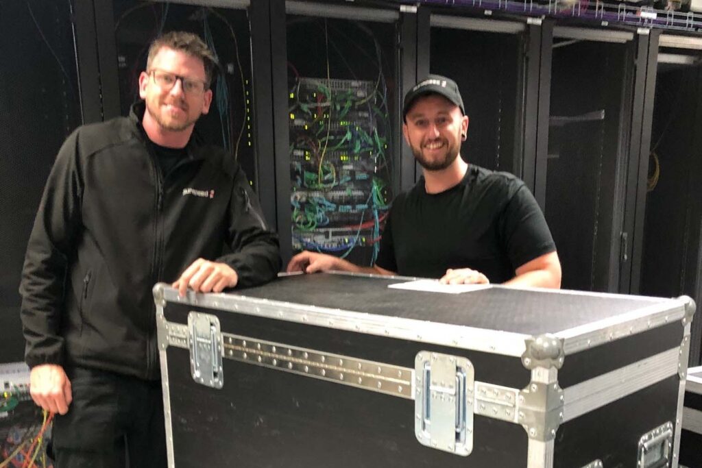 datanet clients bringing their flight storage case into the data centre and beside their full rack in the data aisle